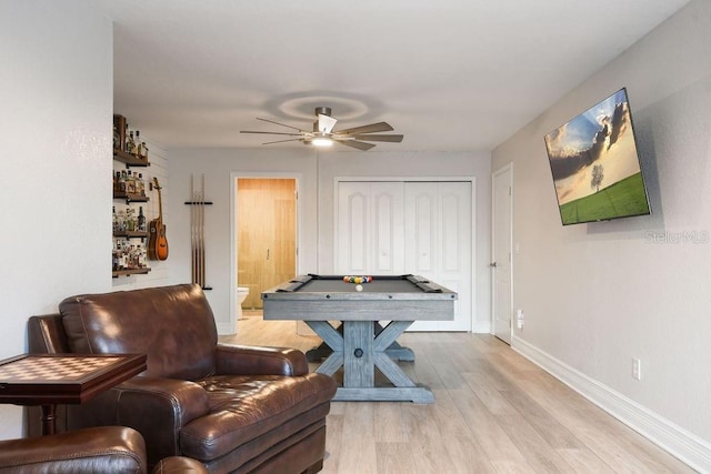 game room featuring ceiling fan, pool table, and light hardwood / wood-style floors