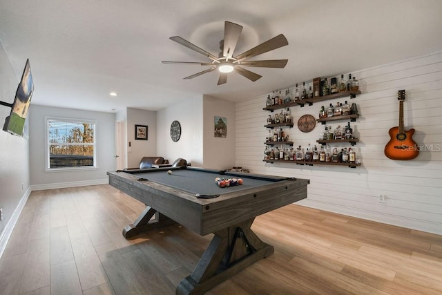 recreation room with ceiling fan, pool table, indoor bar, and light hardwood / wood-style floors