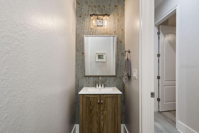 bathroom with vanity and hardwood / wood-style flooring