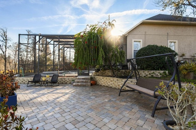 view of patio / terrace with glass enclosure