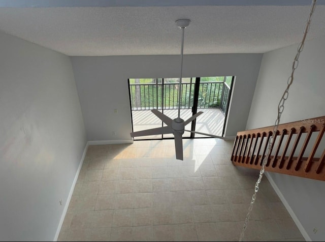 unfurnished room featuring a textured ceiling