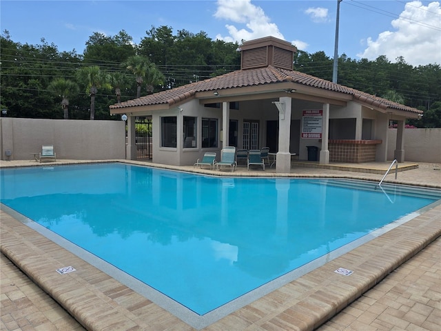 4826 Marks Ter Unit 389, Orlando, FL 32811 - community pool with a patio area