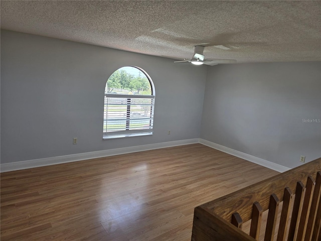 4826 Marks Ter Unit 389, Orlando, FL 32811 - unfurnished room with wood finished floors, a textured ceiling, and ceiling fan