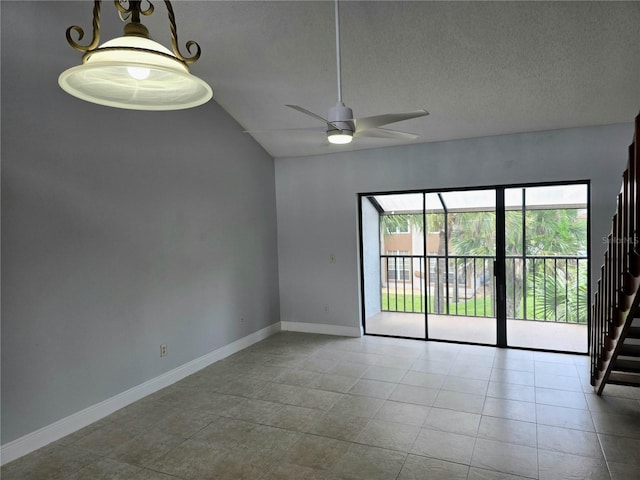 4826 Marks Ter Unit 389, Orlando, FL 32811 - tiled spare room with vaulted ceiling, ceiling fan, and a textured ceiling