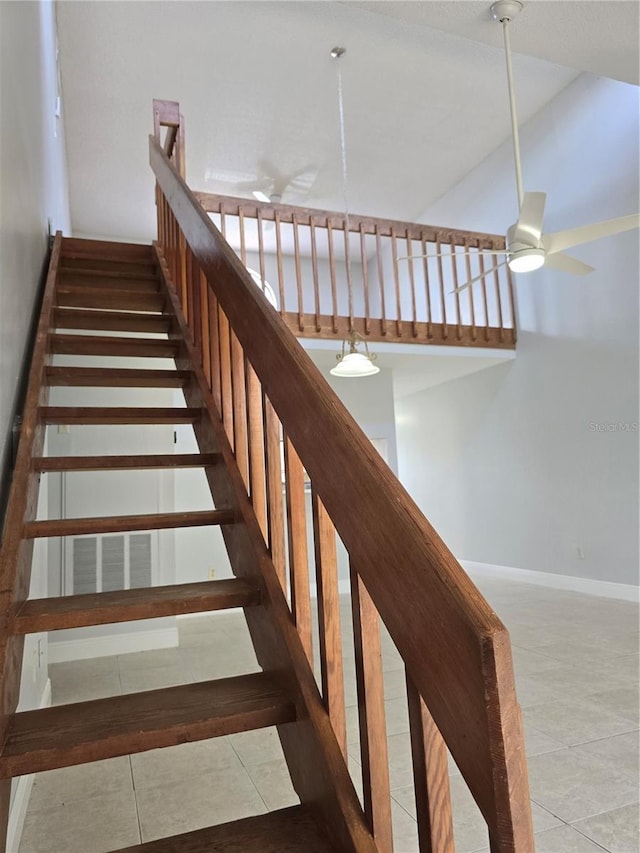 4826 Marks Ter Unit 389, Orlando, FL 32811 - stairs featuring a ceiling fan and tile patterned floors