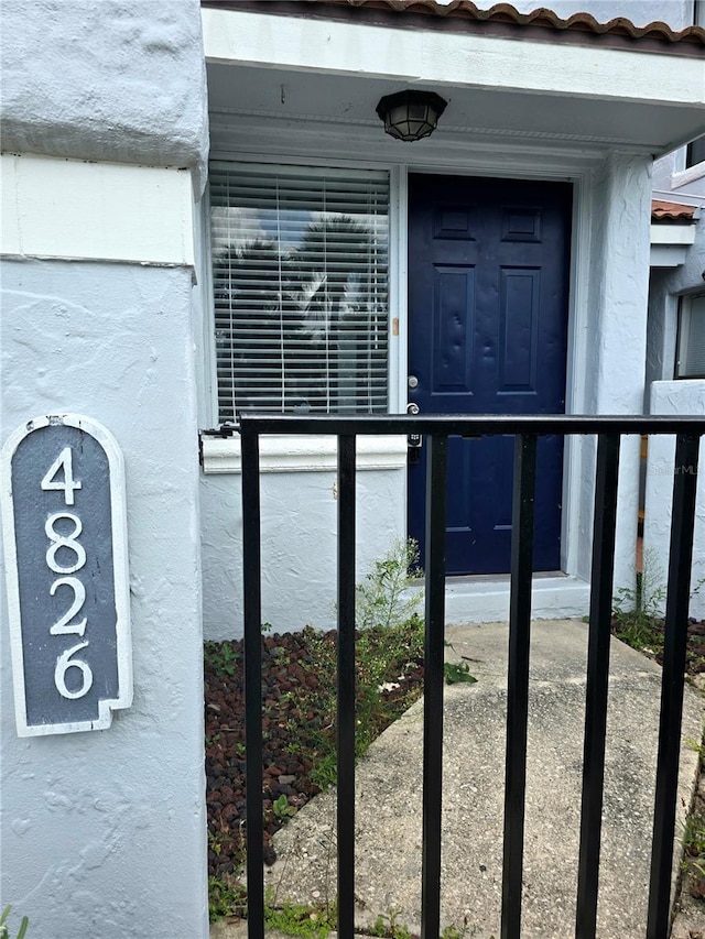 4826 Marks Ter Unit 389, Orlando, FL 32811 - view of exterior entry with stucco siding