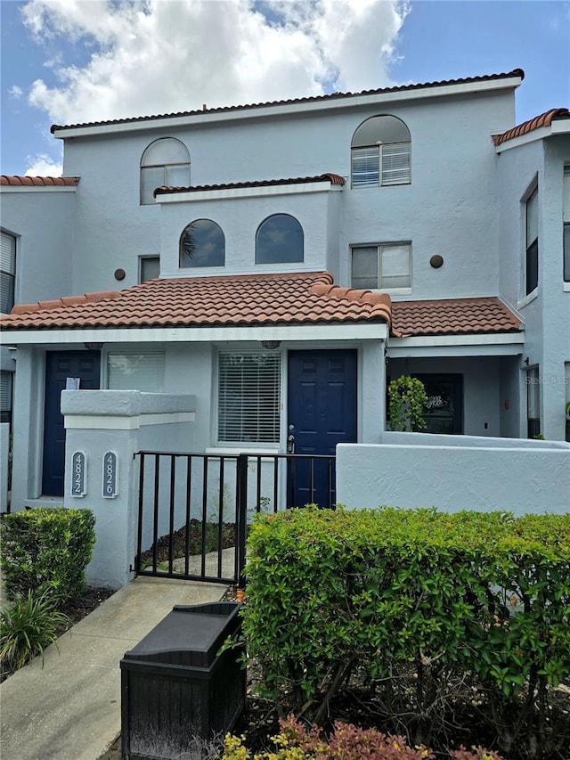 4826 Marks Ter Unit 389, Orlando, FL 32811 - view of front of home with a tiled roof and stucco siding