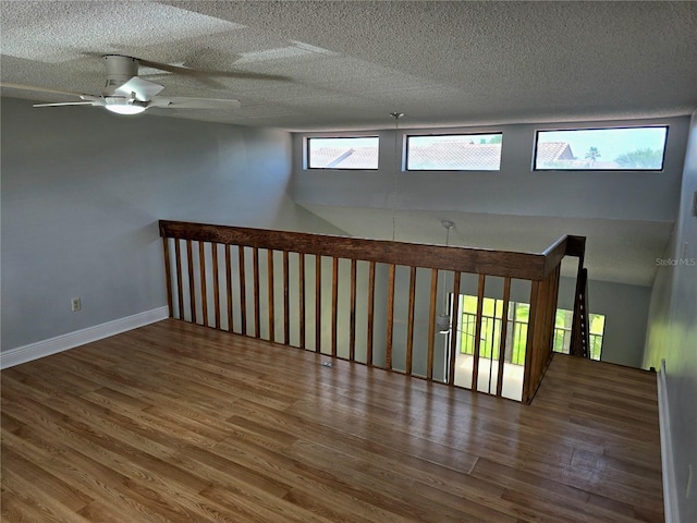 4826 Marks Ter Unit 389, Orlando, FL 32811 - spare room with wood finished floors, a ceiling fan, and a textured ceiling