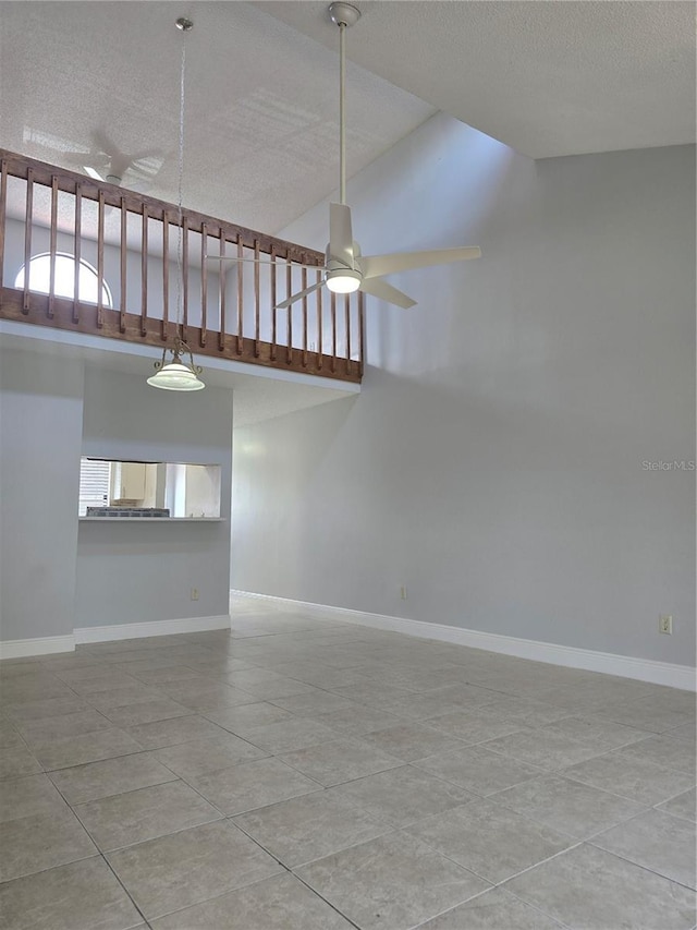 4826 Marks Ter Unit 389, Orlando, FL 32811 - spare room featuring ceiling fan, a textured ceiling, lofted ceiling, and plenty of natural light