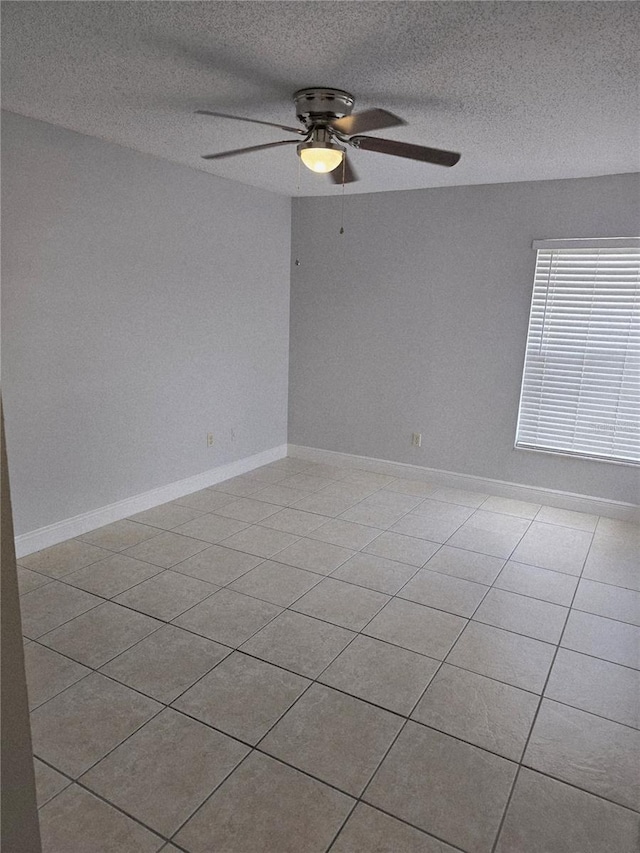 4826 Marks Ter Unit 389, Orlando, FL 32811 - spare room featuring ceiling fan, light tile patterned floors, and a textured ceiling