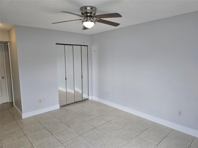 4826 Marks Ter Unit 389, Orlando, FL 32811 - unfurnished bedroom with light tile patterned floors, a closet, and a ceiling fan