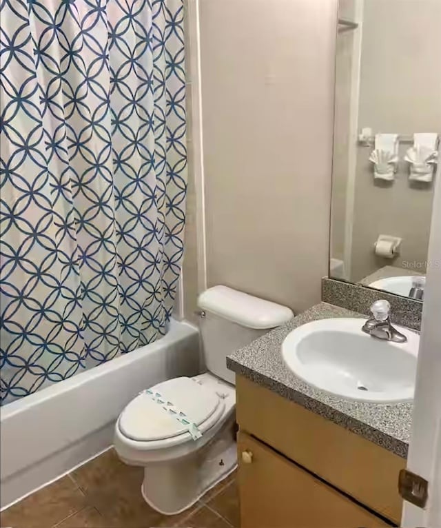 full bathroom featuring vanity, shower / bath combo, tile patterned floors, and toilet