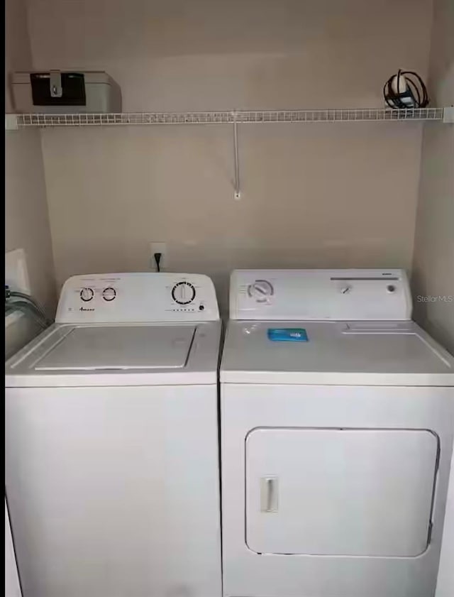 washroom featuring separate washer and dryer