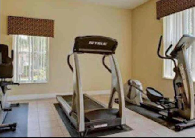 workout area with tile patterned floors