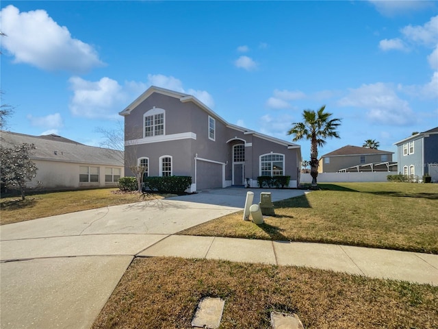 view of front property with a garage and a front lawn