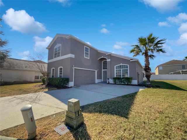 view of front facade featuring a garage and a front yard