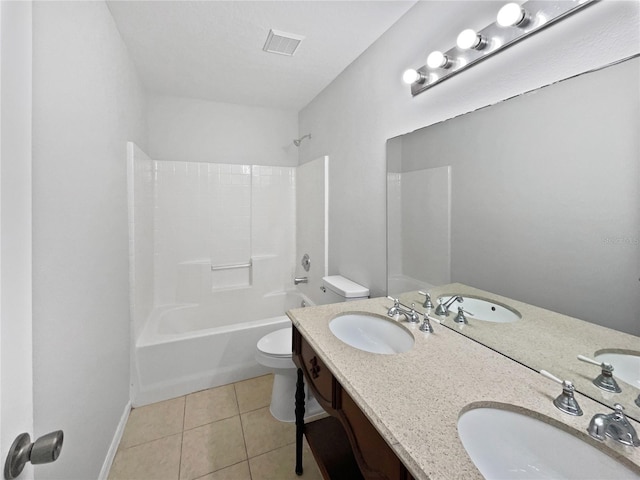 full bathroom featuring bathing tub / shower combination, vanity, tile patterned floors, and toilet