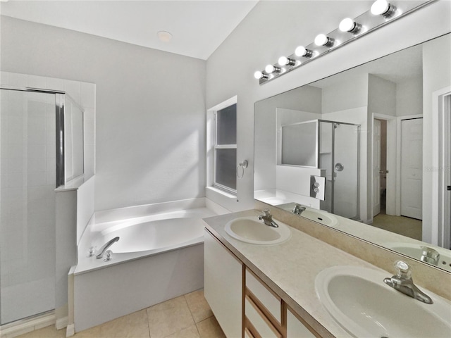 bathroom featuring vanity, shower with separate bathtub, and tile patterned flooring