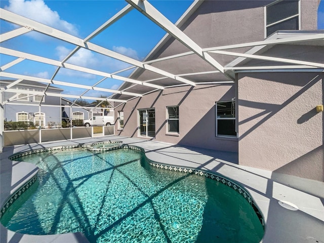 view of pool featuring a lanai and a patio area