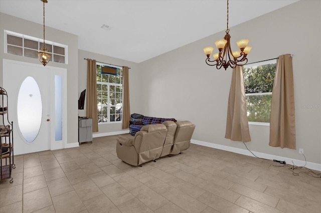 entryway with a chandelier