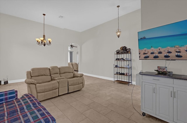 tiled living room featuring ceiling fan