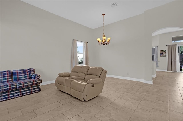 living room featuring a notable chandelier