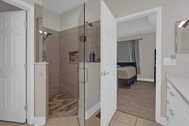 bathroom with vanity, tile patterned floors, and walk in shower