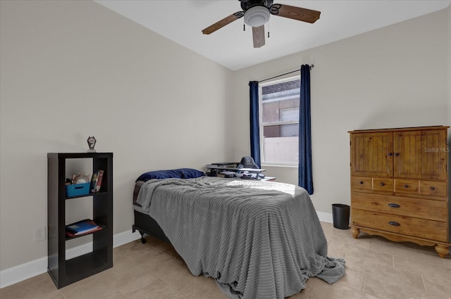 tiled bedroom with ceiling fan