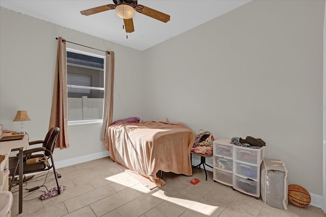 bedroom with ceiling fan and light tile patterned floors