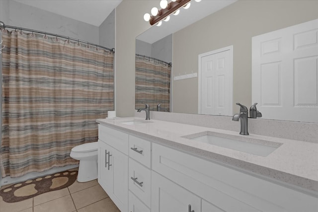 bathroom with tile patterned flooring, vanity, a shower with curtain, and toilet