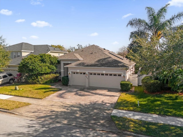 view of front facade with a garage and a front yard