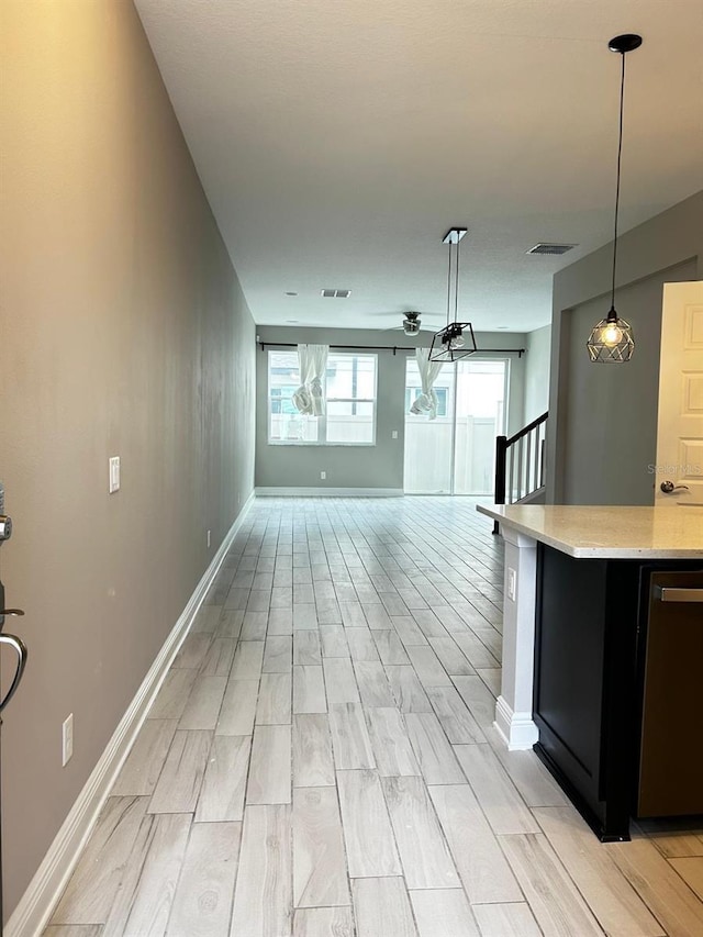 kitchen with dishwasher and pendant lighting