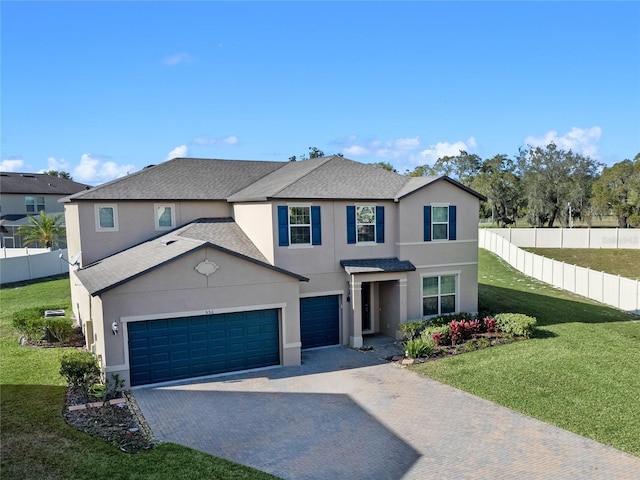 front facade with a garage and a front lawn