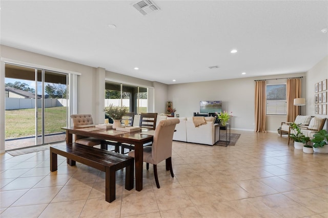 dining space with light tile patterned flooring