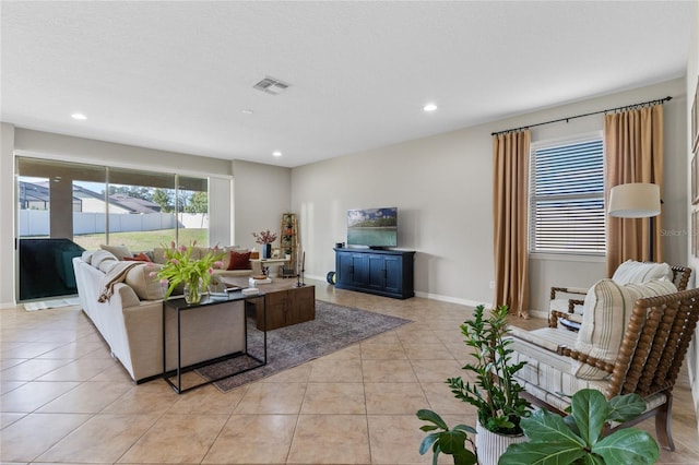 tiled living room with a textured ceiling