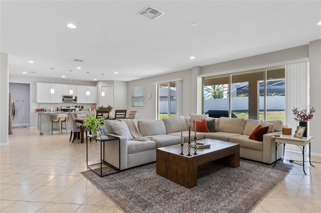 tiled living room with a textured ceiling