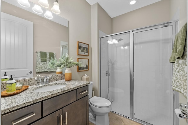 bathroom with a shower with shower door, vanity, a notable chandelier, toilet, and tile patterned floors