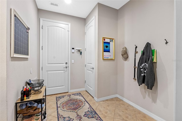 entrance foyer with light tile patterned flooring