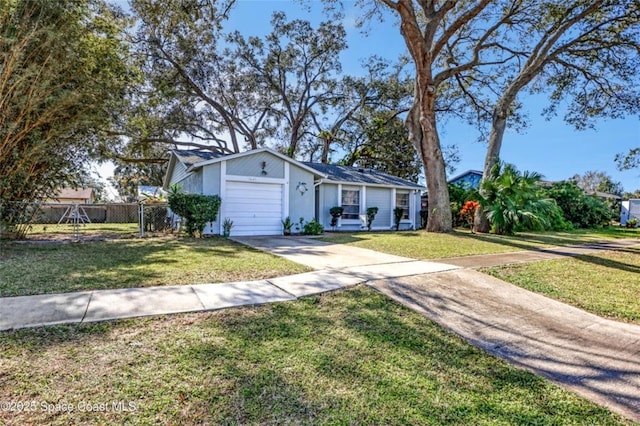 ranch-style house featuring a garage and a front yard