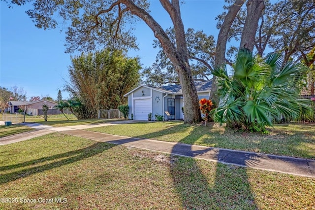 view of front facade with a garage and a front yard