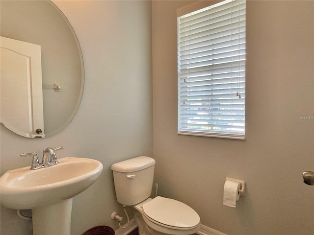 bathroom with sink and toilet