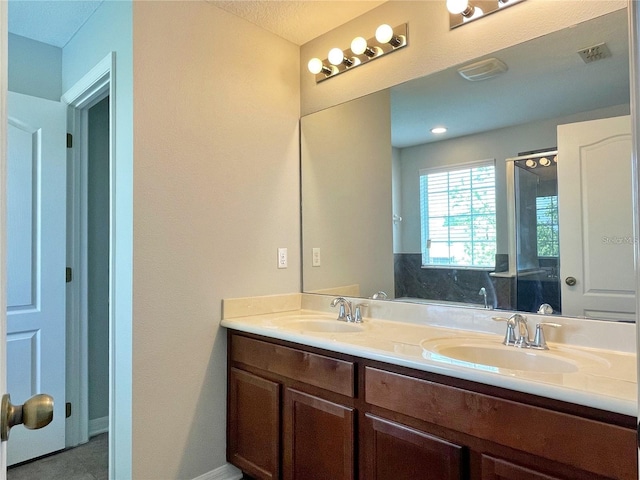 bathroom with vanity and a bathing tub