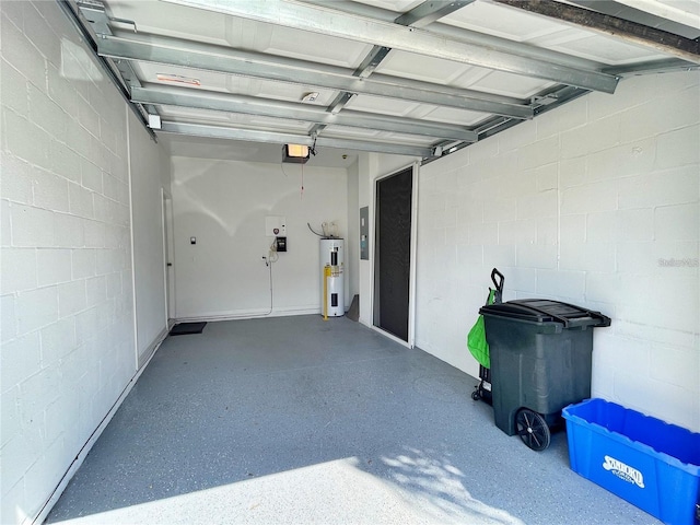 garage with a garage door opener and water heater