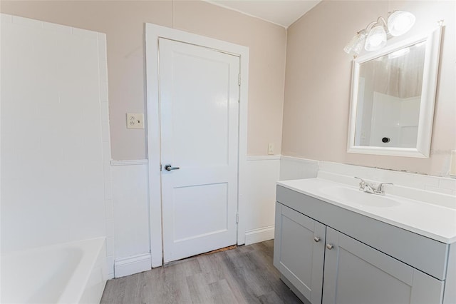 full bath featuring vanity and wood finished floors