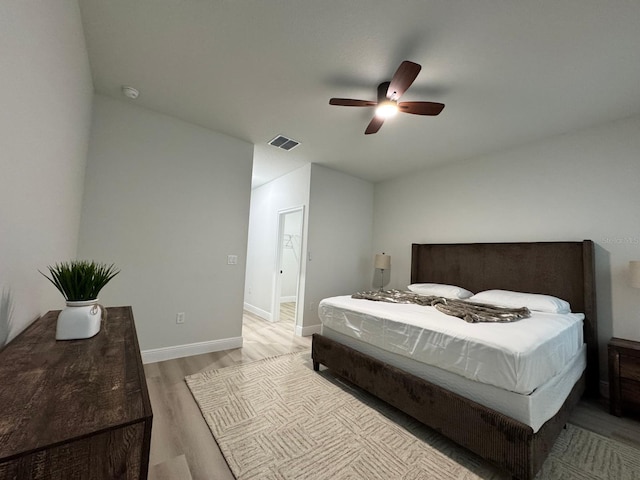150 Marion Oaks Trl, Ocala, FL 34473 - bedroom featuring visible vents, light wood-type flooring, baseboards, and a ceiling fan