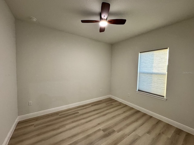 150 Marion Oaks Trl, Ocala, FL 34473 - spare room with baseboards, a ceiling fan, and wood finished floors