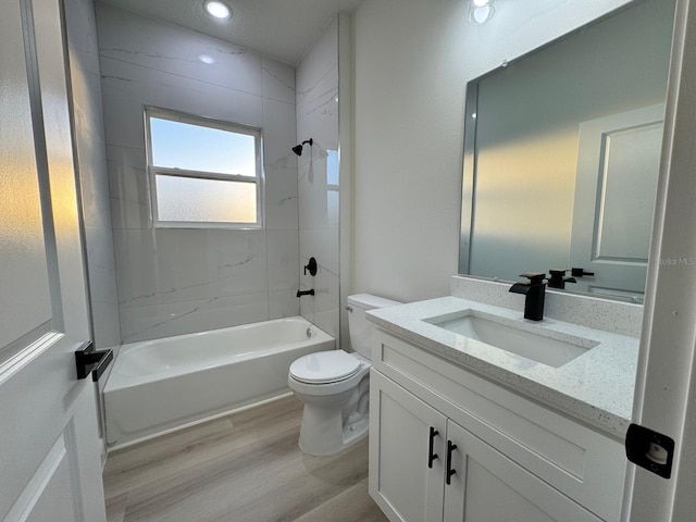 150 Marion Oaks Trl, Ocala, FL 34473 - bathroom featuring washtub / shower combination, vanity, recessed lighting, toilet, and wood finished floors