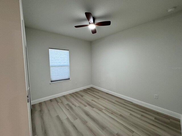 150 Marion Oaks Trl, Ocala, FL 34473 - empty room with ceiling fan, wood finished floors, and baseboards