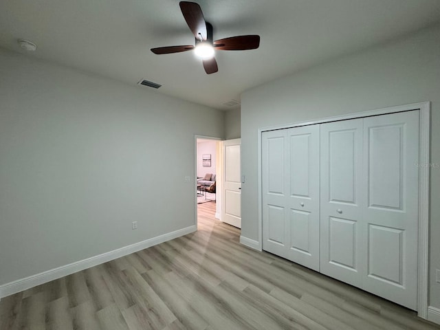 150 Marion Oaks Trl, Ocala, FL 34473 - unfurnished bedroom featuring a closet, a ceiling fan, visible vents, light wood finished floors, and baseboards