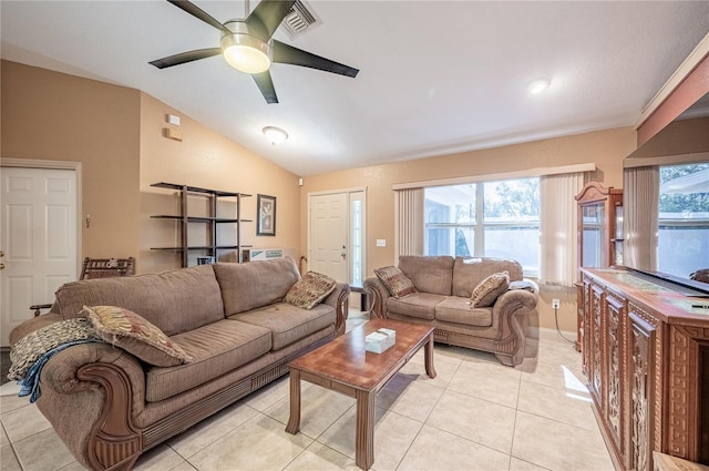 tiled living room with ceiling fan and lofted ceiling